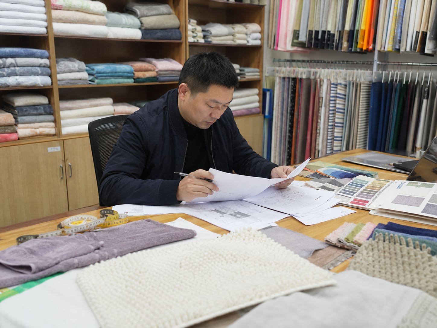 Home textile product specifications being reviewed before production